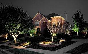 Large house with outdoor lighting.