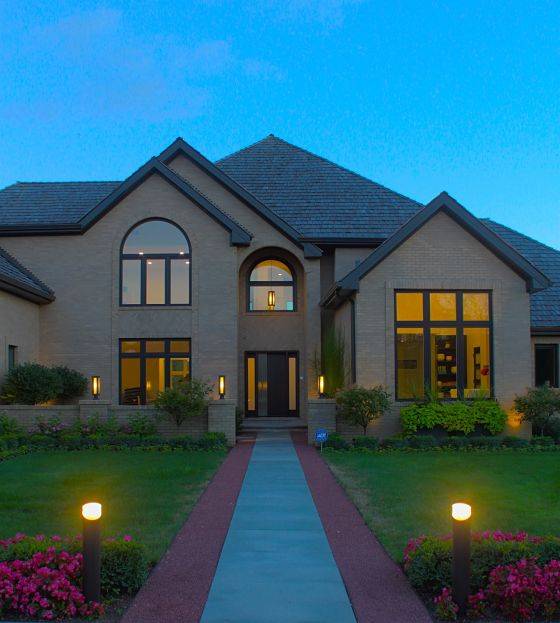 A house with Northbrook landscape lighting in the front of the house..