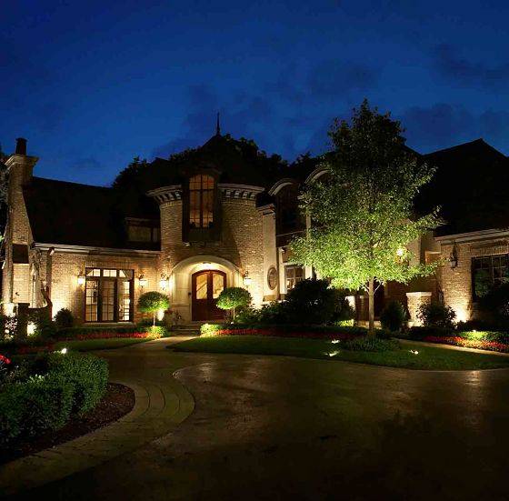 Large house with lighting system from outdoor lighting professional American National.