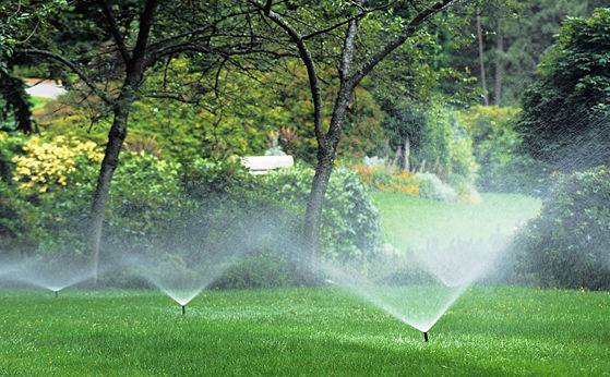 An underground sprinkler system watering a large property.