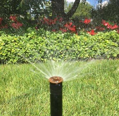 An up close view of a sprinkler in action from a commercial irrigation company, American National.
