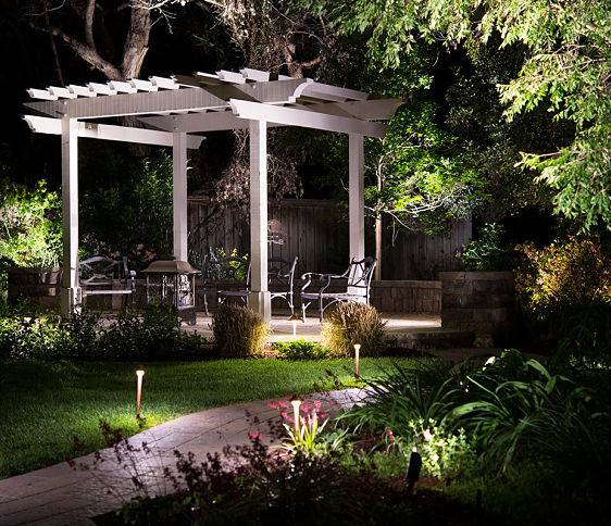 A landscape lighting installation company, American National, set up backyard lights.