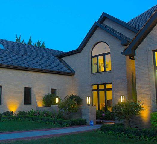 The front of a house with outdoor security lighting by American National.