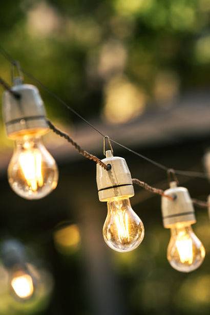 Artistic outdoor lighting - use stringer lights to create an ambiance.