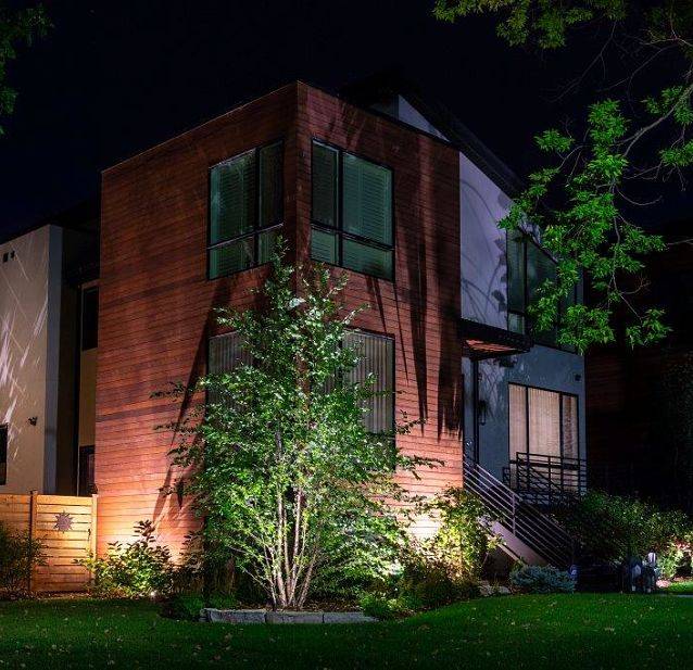 Front backyard lighting on a bush - outdoor lighting system by American National Sprinkler & Lighting.