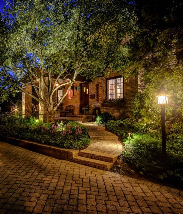 Outdoor lighting design on an outdoor pathway of a home - installed by American National Sprinkler & Lighting.