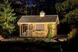 American National Sprinkler & Lighting - automatic lighting system illuminating shed in the backyard.