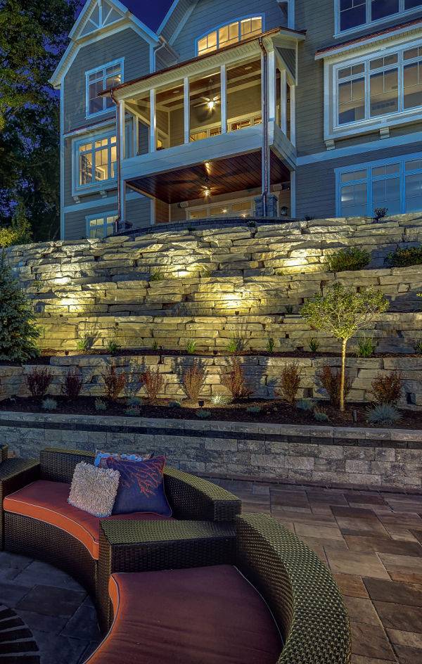 American National Sprinkler & Lighting - outdoor lighting contractor added automatic lighting system to this outdoor living area.