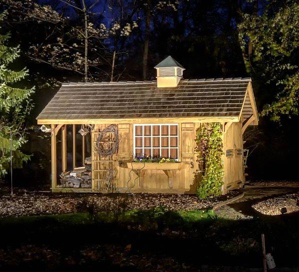 American National Sprinkler & Lighting - this Highland Park home has Highland Park landscape lighting in their backyard highlighting a decorative shed.