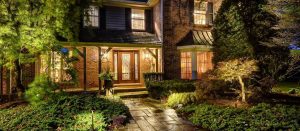 American National Sprinkler & Lighting - a home in Northbrook, IL with an outdoor landscape lighting in the front of the home.