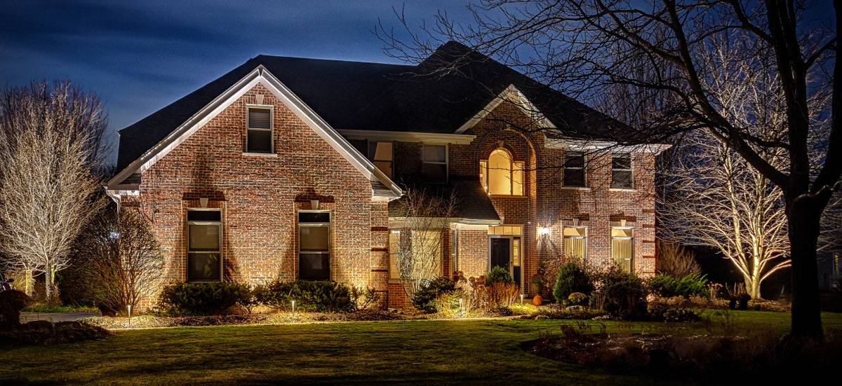 American National Sprinkler & Lighting - landscape lighting system installed in a home in Hawthorn Woods - front of home.