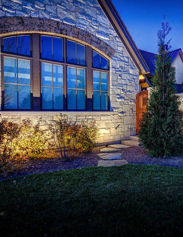 American National Sprinkler & Lighting - Green Oaks Landscape Lighting - outdoor lighting system in the front of Green Oaks home.