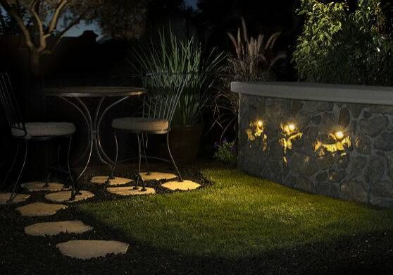 Custome outdoor lighting on a bar area at night.