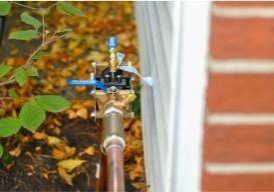 American National Sprinkler & Lighting - backflow preventer installed - the process of installing a sprinkler system.